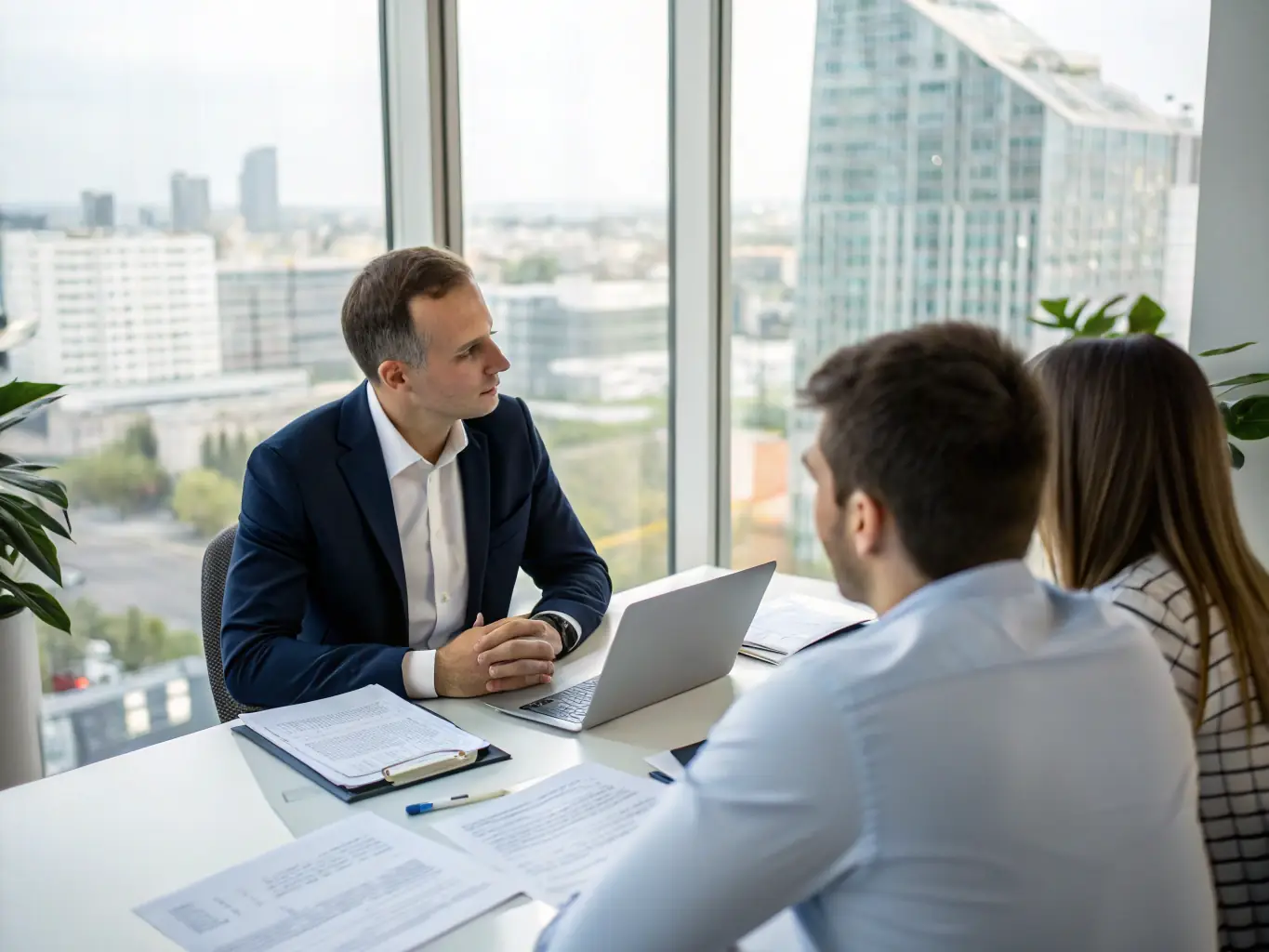 A student receiving personalized financial advice from a consultant, discussing investment options and financial planning strategies in a professional office setting.